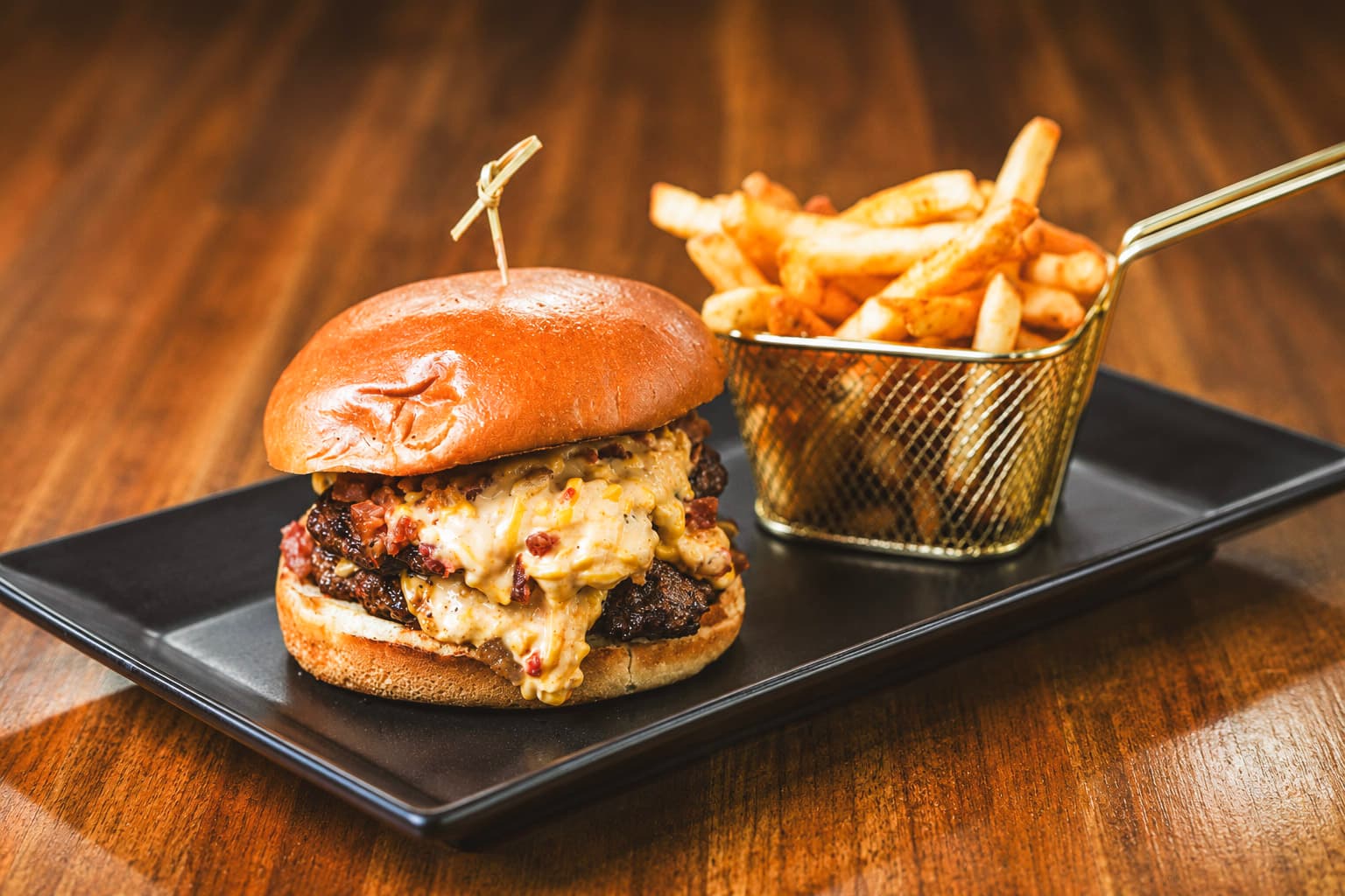 Bourbon Boss burger with pork belly bourbon jam and french fries